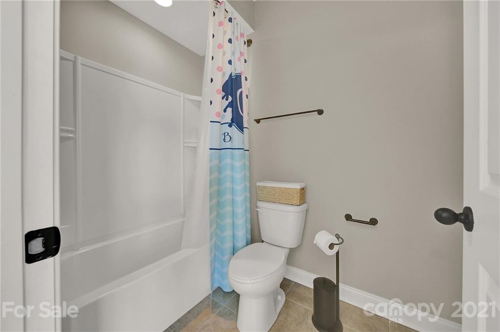 1033 Emory Lane Fort Mill, SC 29708 - Photo 27 of 48 a white toilet sitting next to a bath tub