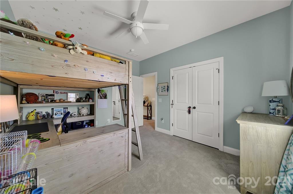 1033 Emory Lane Fort Mill, SC 29708 - Photo 28 of 48 a view of a livingroom with furniture and a ceiling fan