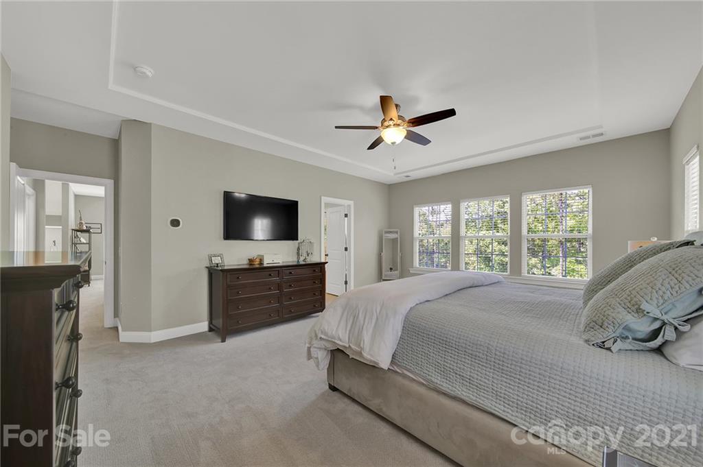 1033 Emory Lane Fort Mill, SC 29708 - Photo 31 of 48 a bedroom with a bed and a flat screen tv