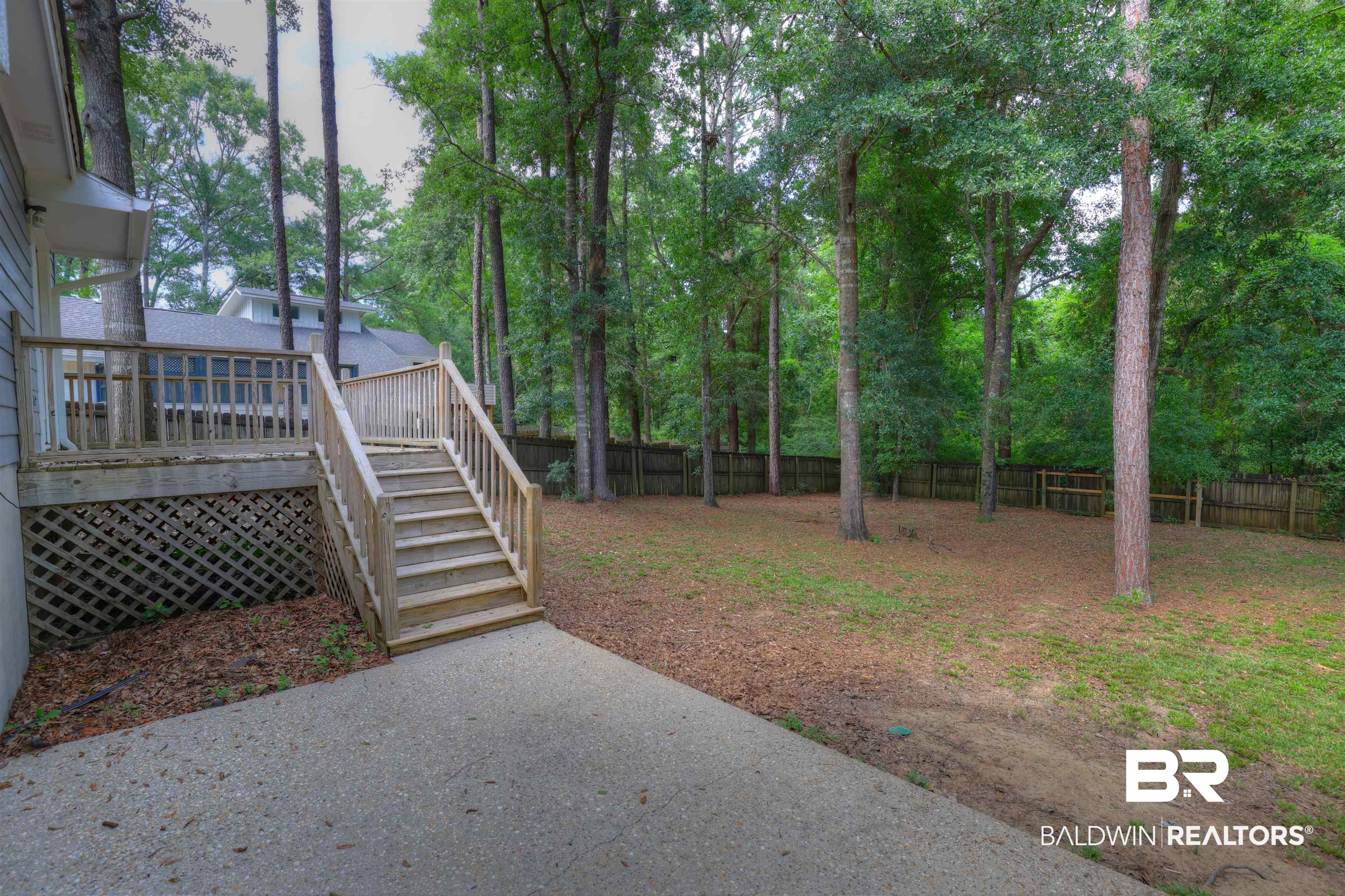 492 Ridgewood Drive Daphne, AL 36526 - Photo 16 of 17 View of yard with a deck