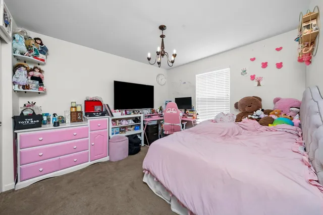 a bathroom with a sink and mirror with toilet