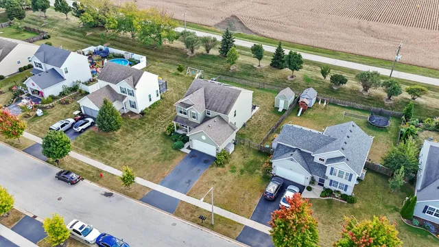 an aerial view of a house with outdoor space