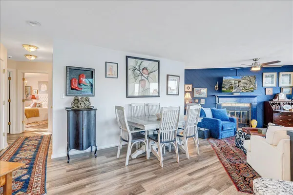 a balcony with furniture and wooden floor