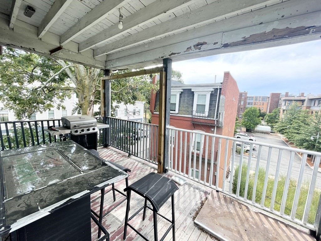 9 Mt Pleasant Avenue, Unit 3 Boston, MA 02119 - Photo 19 of 19 a view of a balcony with furniture