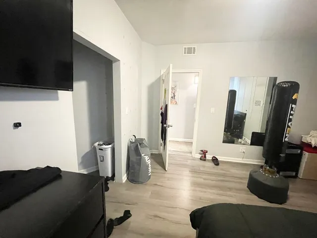 a view of living room with furniture and a flat screen tv