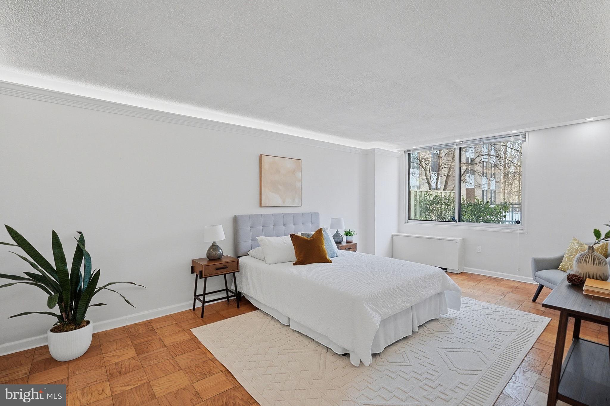 3001 Veazey Street Northwest, Unit 116 Washington, DC 20008 - Photo 13 of 40 a bedroom with a large bed and a window