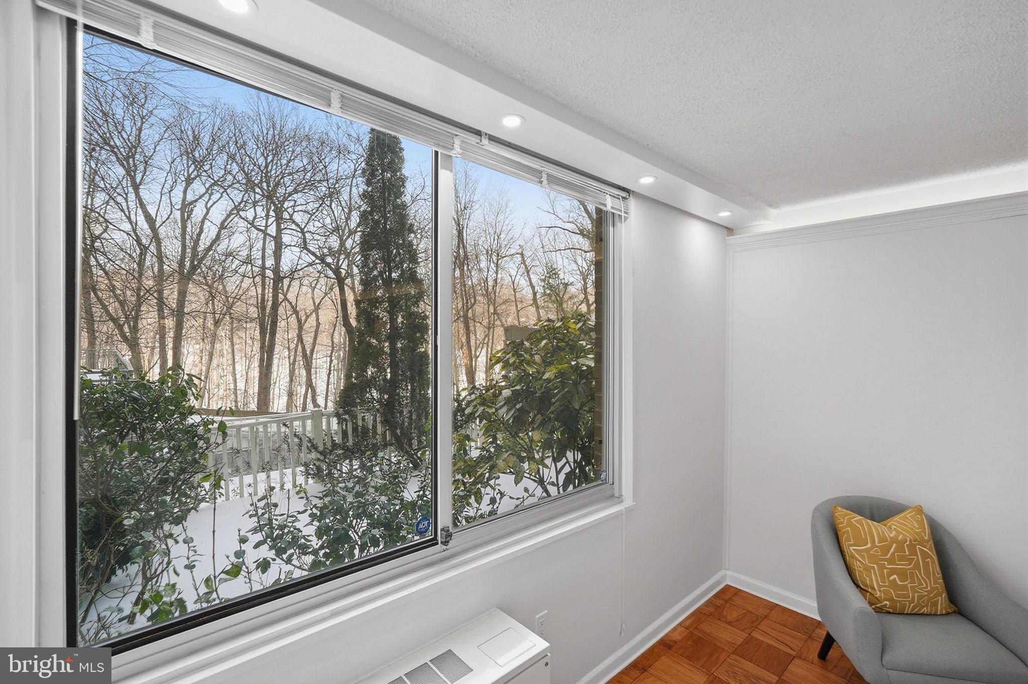 3001 Veazey Street Northwest, Unit 116 Washington, DC 20008 - Photo 14 of 40 a room with a bed and a large window with outer view