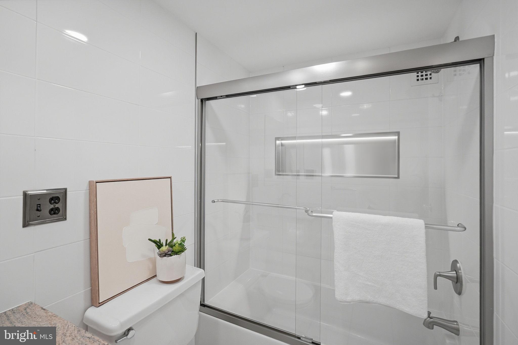 3001 Veazey Street Northwest, Unit 116 Washington, DC 20008 - Photo 22 of 40 a bathroom with a shower and a sink