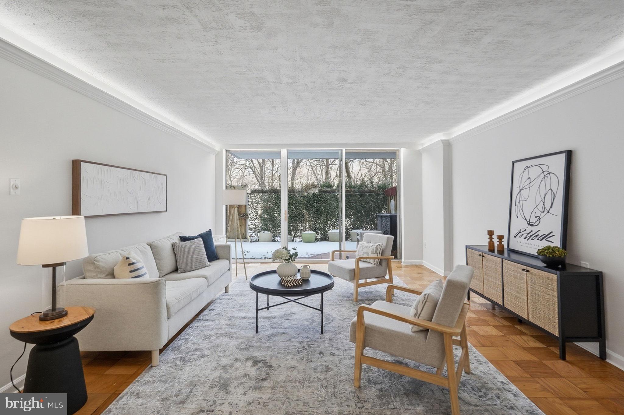 3001 Veazey Street Northwest, Unit 116 Washington, DC 20008 - Photo 5 of 40 a living room with furniture and a large window