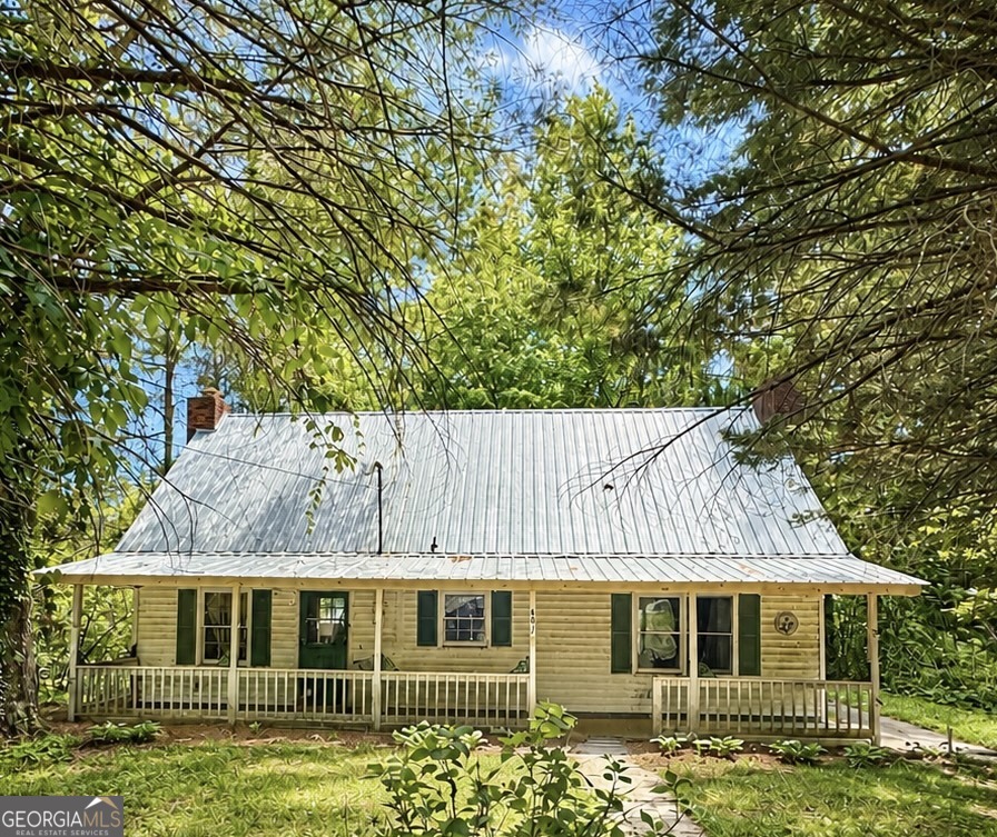 front view of a house with a garden