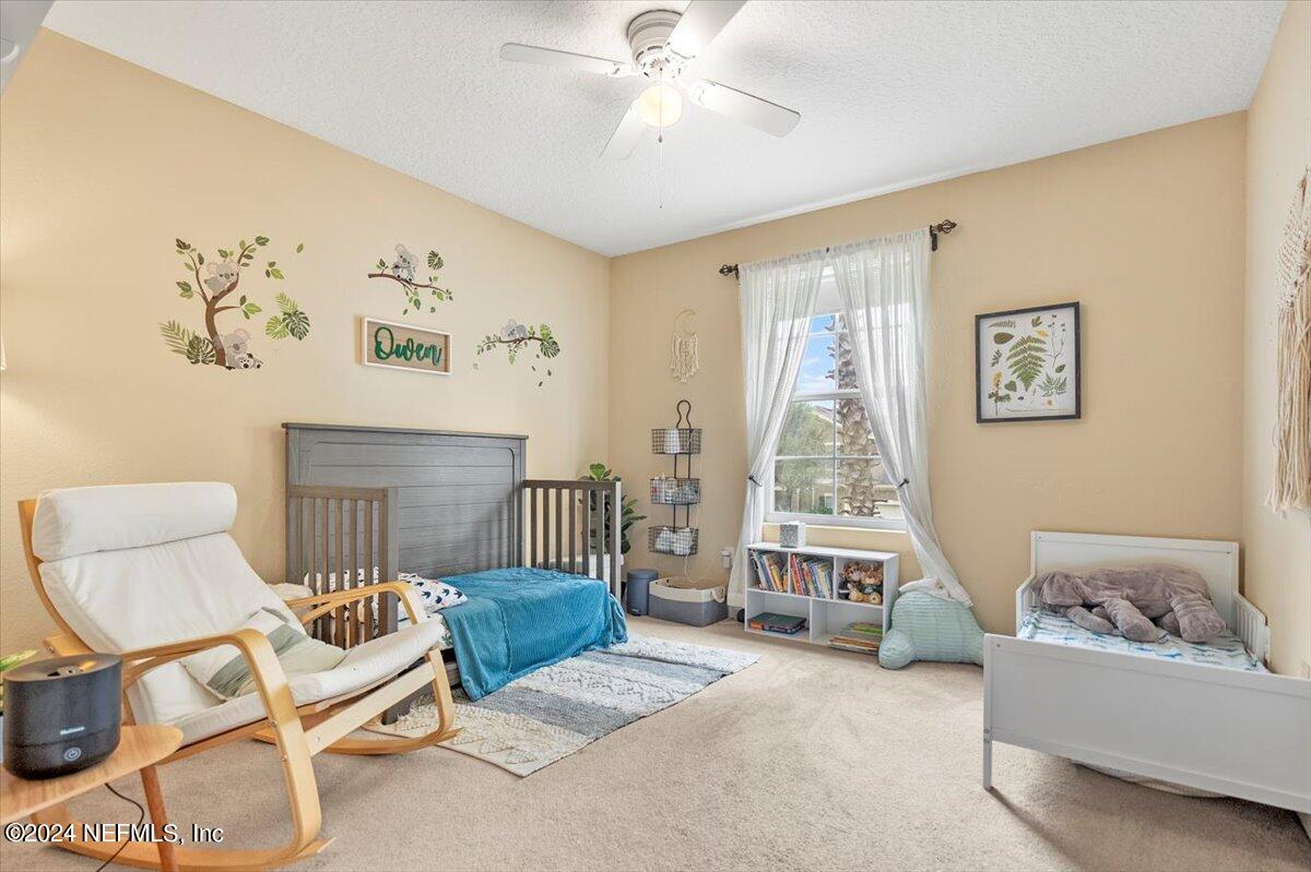 16402 Tisons Bluff Road Jacksonville, FL 32218 - Photo 19 of 45 a living room with furniture and a large window