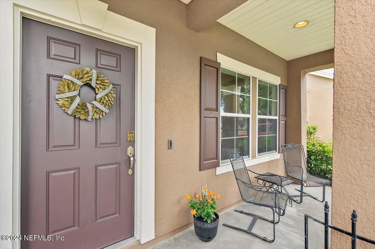 16402 Tisons Bluff Road Jacksonville, FL 32218 - Photo 2 of 45 a front view of a house with outdoor seating