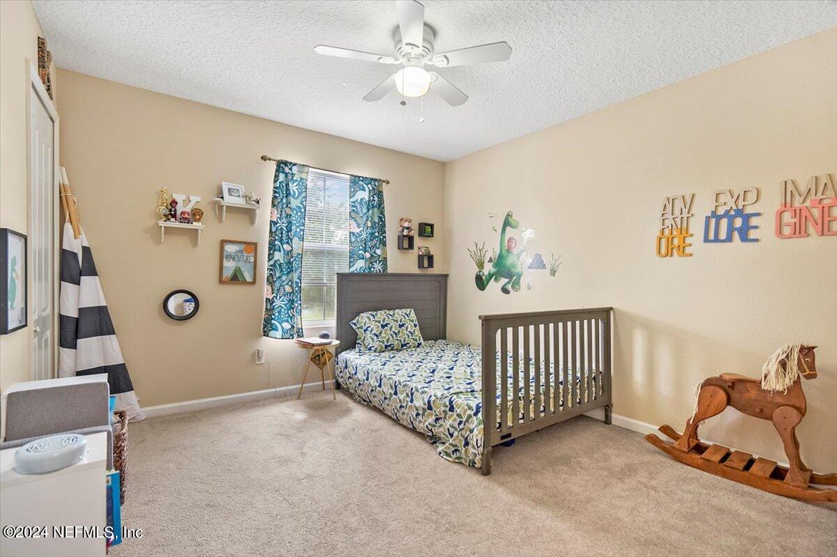 16402 Tisons Bluff Road Jacksonville, FL 32218 - Photo 23 of 45 a living room with furniture and a window