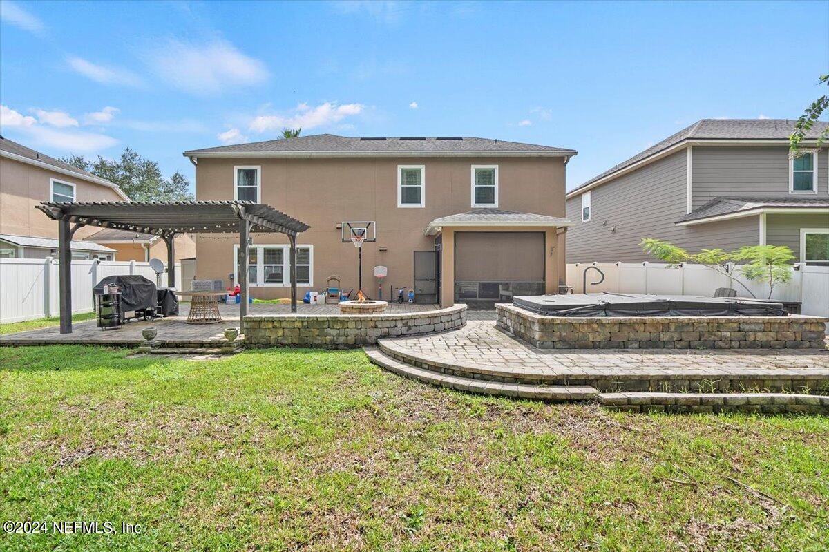 16402 Tisons Bluff Road Jacksonville, FL 32218 - Photo 33 of 45 a view of a house with swimming pool and a yard