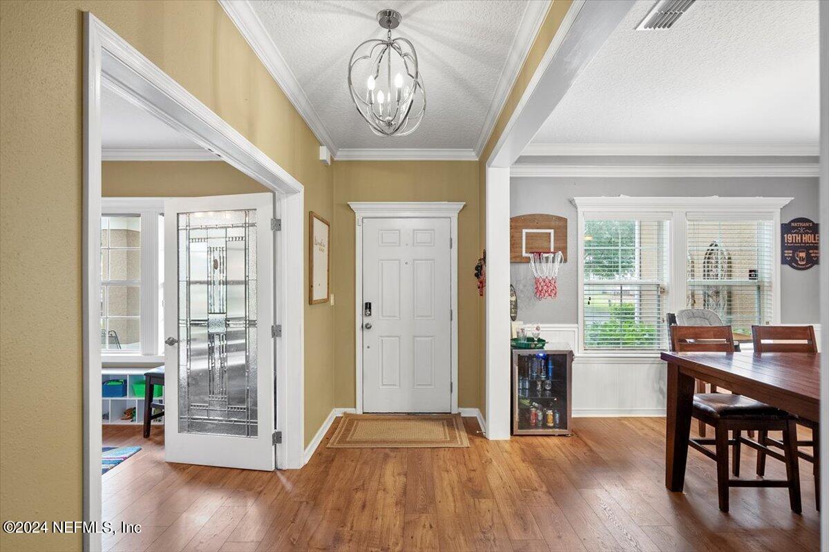 16402 Tisons Bluff Road Jacksonville, FL 32218 - Photo 4 of 45 a view of a dining room with furniture window and wooden floor