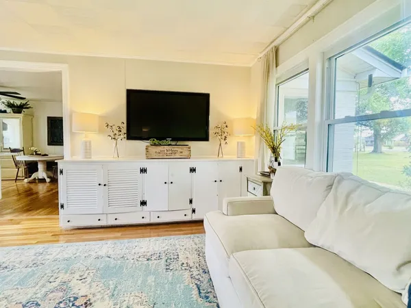 a living room with furniture and a flat screen tv