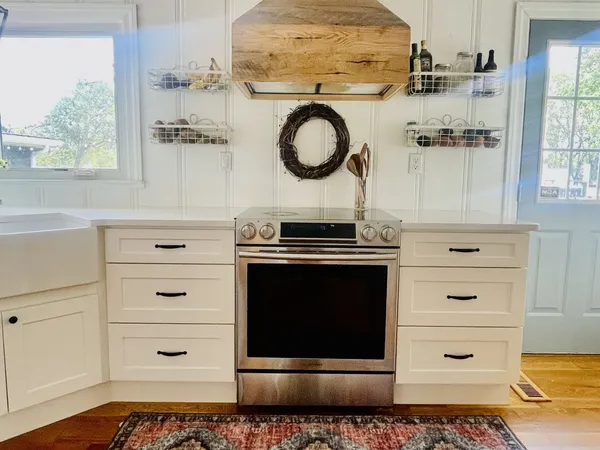 a kitchen with a stove and a microwave