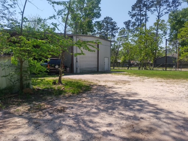 14633 Half Circle Splendora, TX 77372 - Photo 5 of 11 a backyard of a house with lots of green space