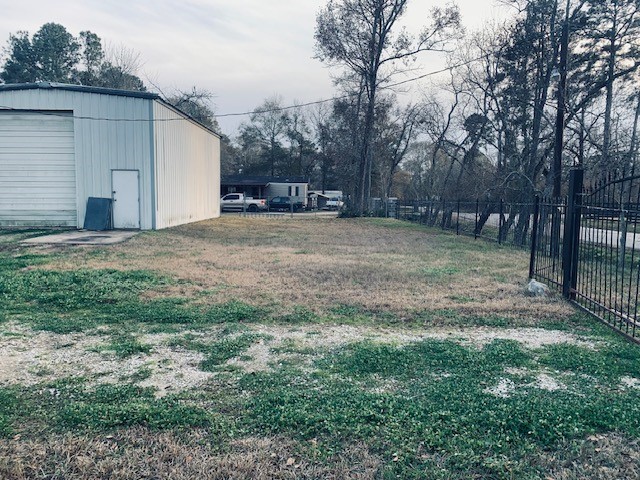 14633 Half Circle Splendora, TX 77372 - Photo 7 of 11 a view of a backyard with large trees