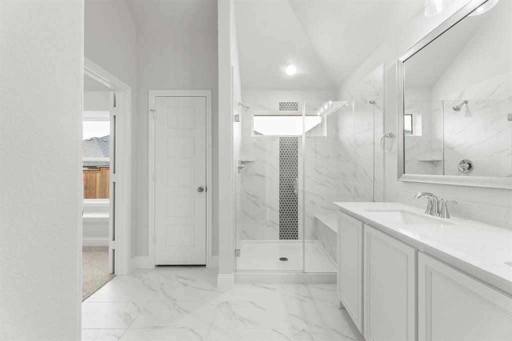 14422 Mietner Street Pilot Point, TX 76258 - Photo 11 of 23 a spacious bathroom with a shower sink and mirror