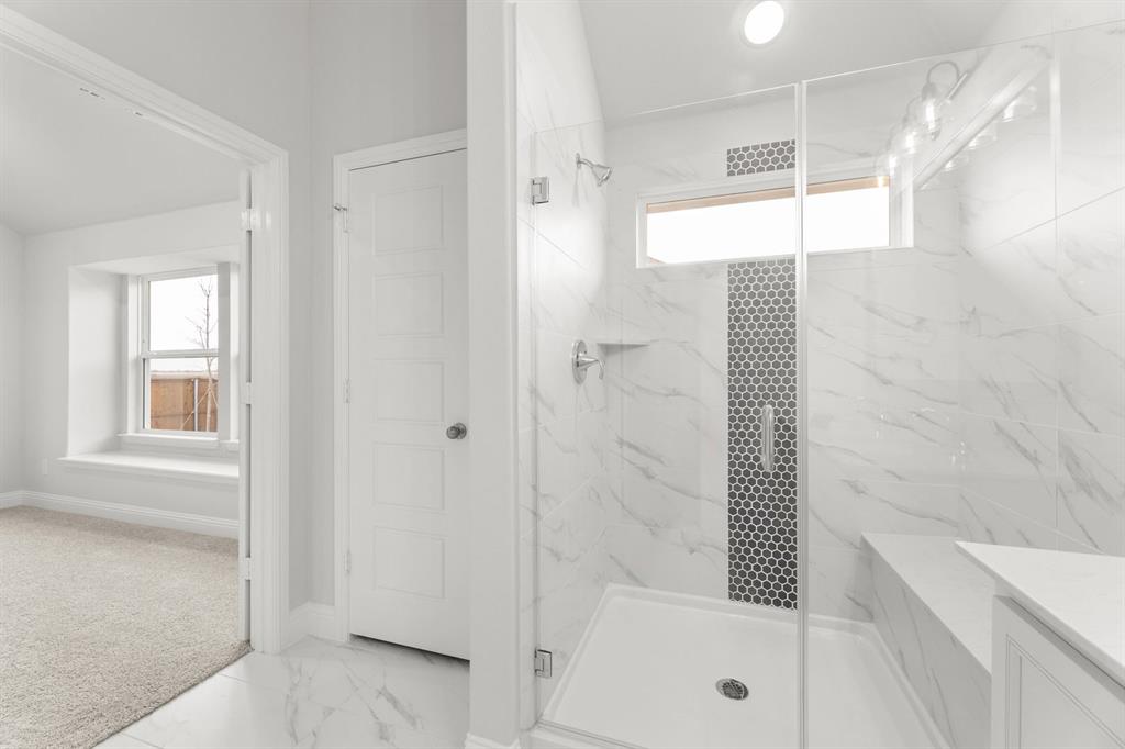 14422 Mietner Street Pilot Point, TX 76258 - Photo 12 of 23 a bathroom with a bathtub and shower