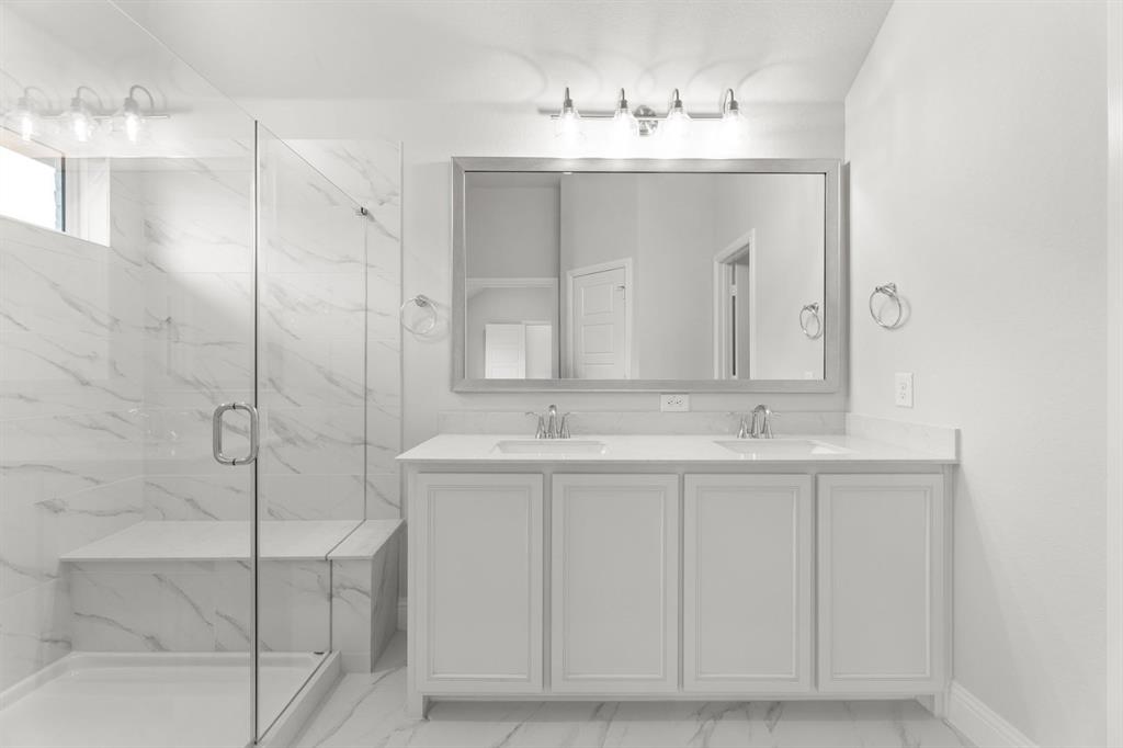 14422 Mietner Street Pilot Point, TX 76258 - Photo 13 of 23 a bathroom with a double vanity sink mirror and