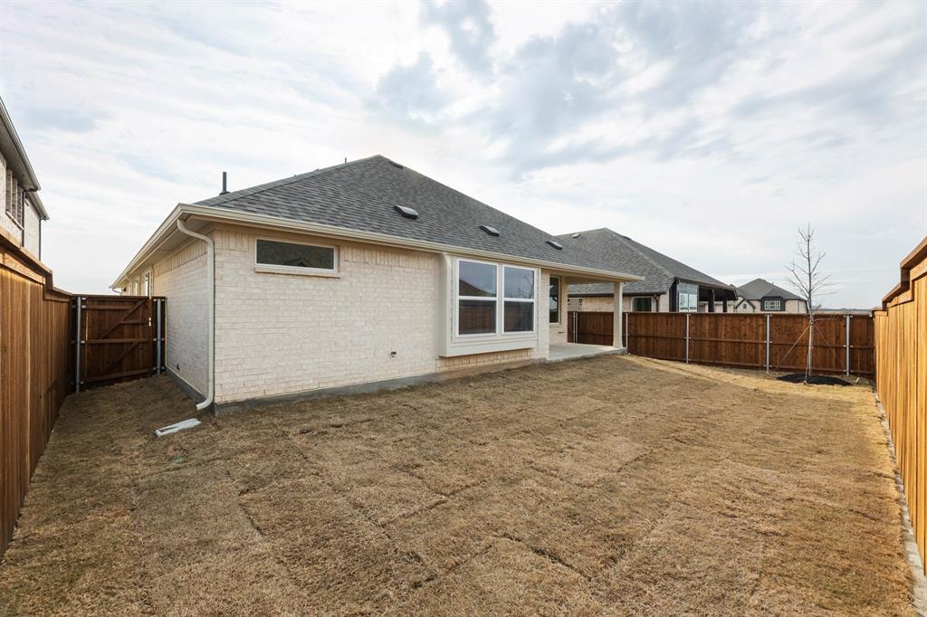 14422 Mietner Street Pilot Point, TX 76258 - Photo 23 of 23 a view of a house with a backyard