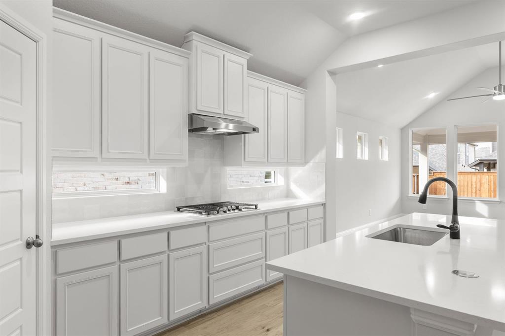 14422 Mietner Street Pilot Point, TX 76258 - Photo 7 of 23 a kitchen with a sink and cabinets