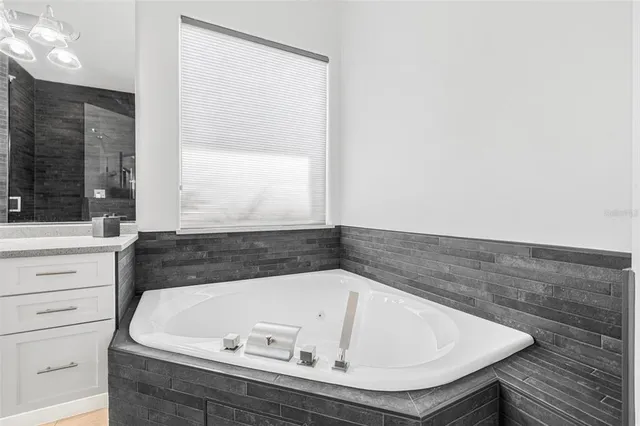 a bathroom with a bathtub and a sink