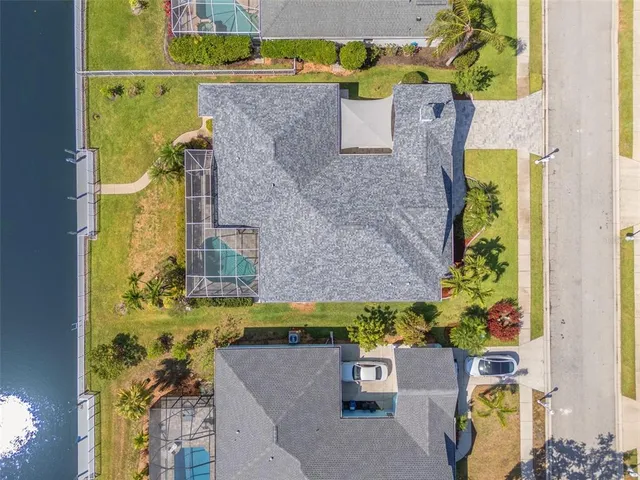an aerial view of a house with a swimming pool
