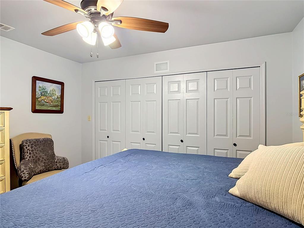 1395 Maytown Road Osteen, FL 32764 - Photo 36 of 65 a bedroom with a bed and a ceiling fan