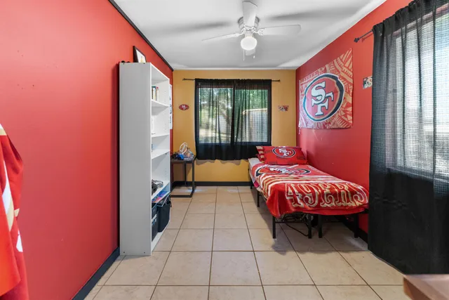 a bed room with a bed and a window