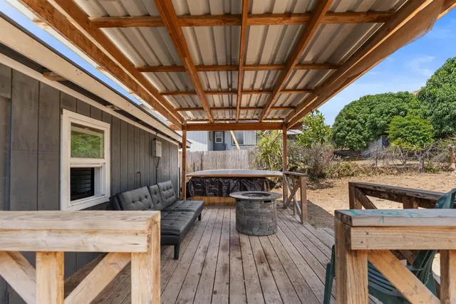 a patio with a table and chairs