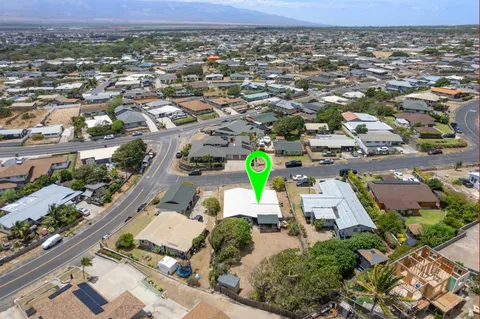 an aerial view of a house with a garden