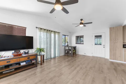 a bedroom with furniture and a ceiling fan