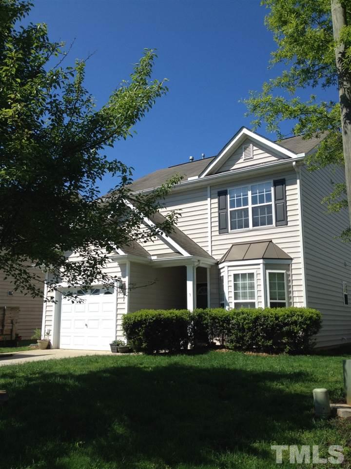 8425 Aztec Dawn Court Raleigh, NC 27613 - Photo 1 of 8 a front view of a house with a yard