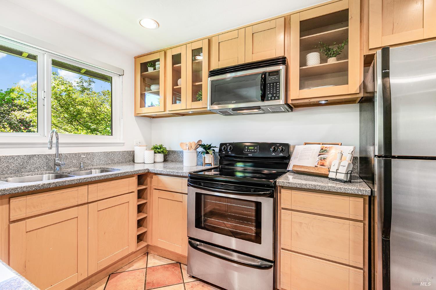 29 Woodgreen Street Santa Rosa, CA 95409 - Photo 11 of 42 a kitchen with a stove microwave and refrigerator