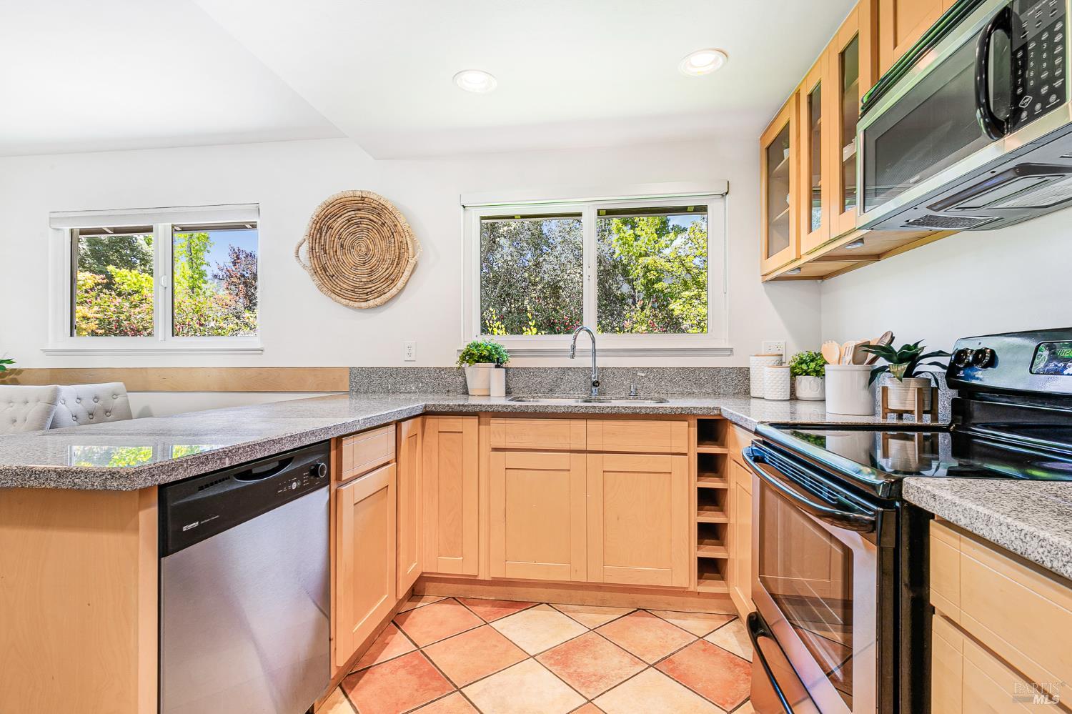 29 Woodgreen Street Santa Rosa, CA 95409 - Photo 12 of 42 a kitchen with stainless steel appliances granite countertop a sink and a stove