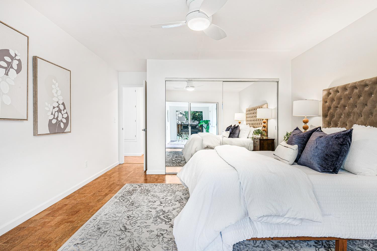 29 Woodgreen Street Santa Rosa, CA 95409 - Photo 18 of 42 a bedroom with a large bed and a large window