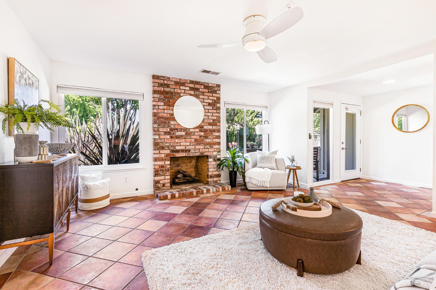 29 Woodgreen Street Santa Rosa, CA 95409 - Photo 5 of 42 a living room with furniture a fireplace and a potted plant