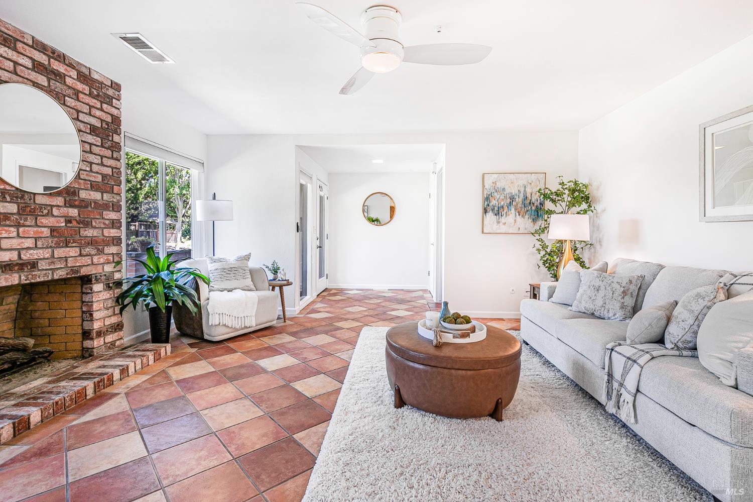 29 Woodgreen Street Santa Rosa, CA 95409 - Photo 6 of 42 a living room with patio furniture and a fireplace