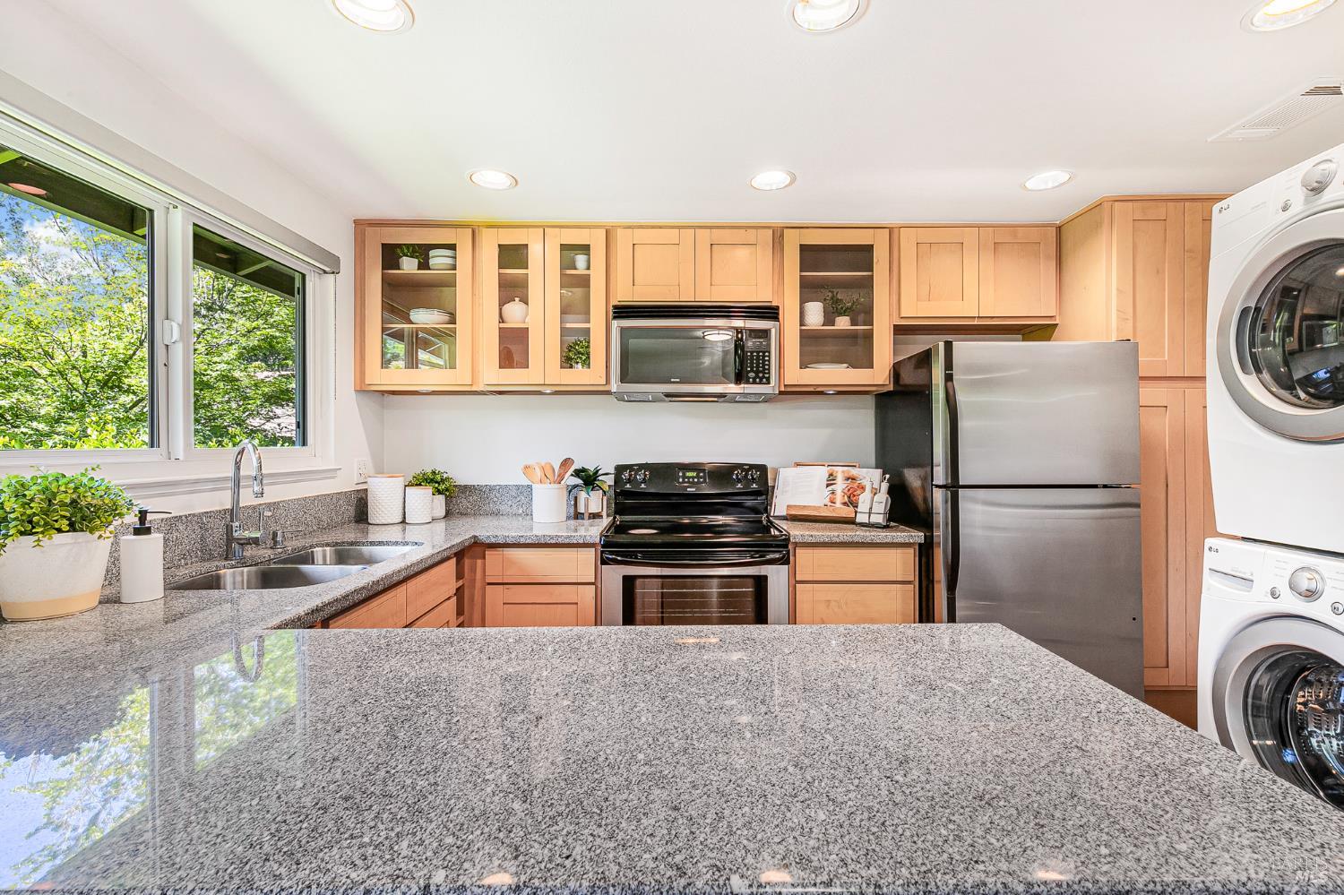 29 Woodgreen Street Santa Rosa, CA 95409 - Photo 10 of 42 a kitchen with a refrigerator and a sink