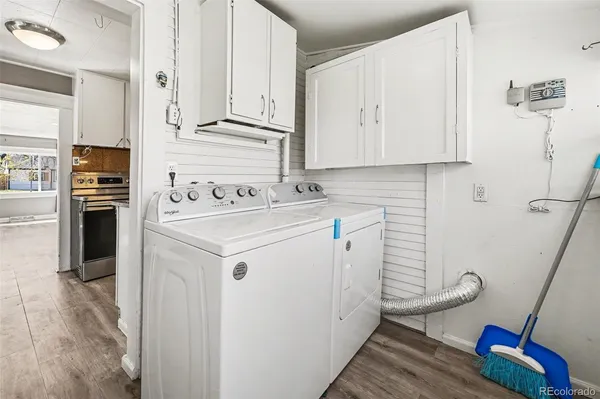 a utility room with sink washer and dryer