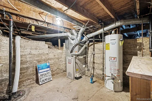 a view of backyard of house with outdoor seating and green space