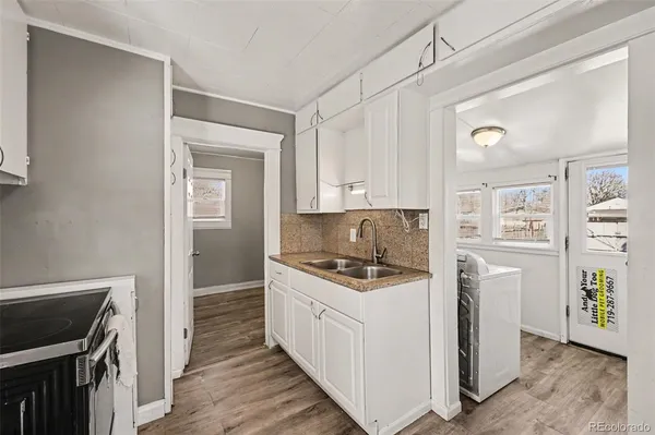 a kitchen with stainless steel appliances granite countertop a stove a refrigerator and a stove