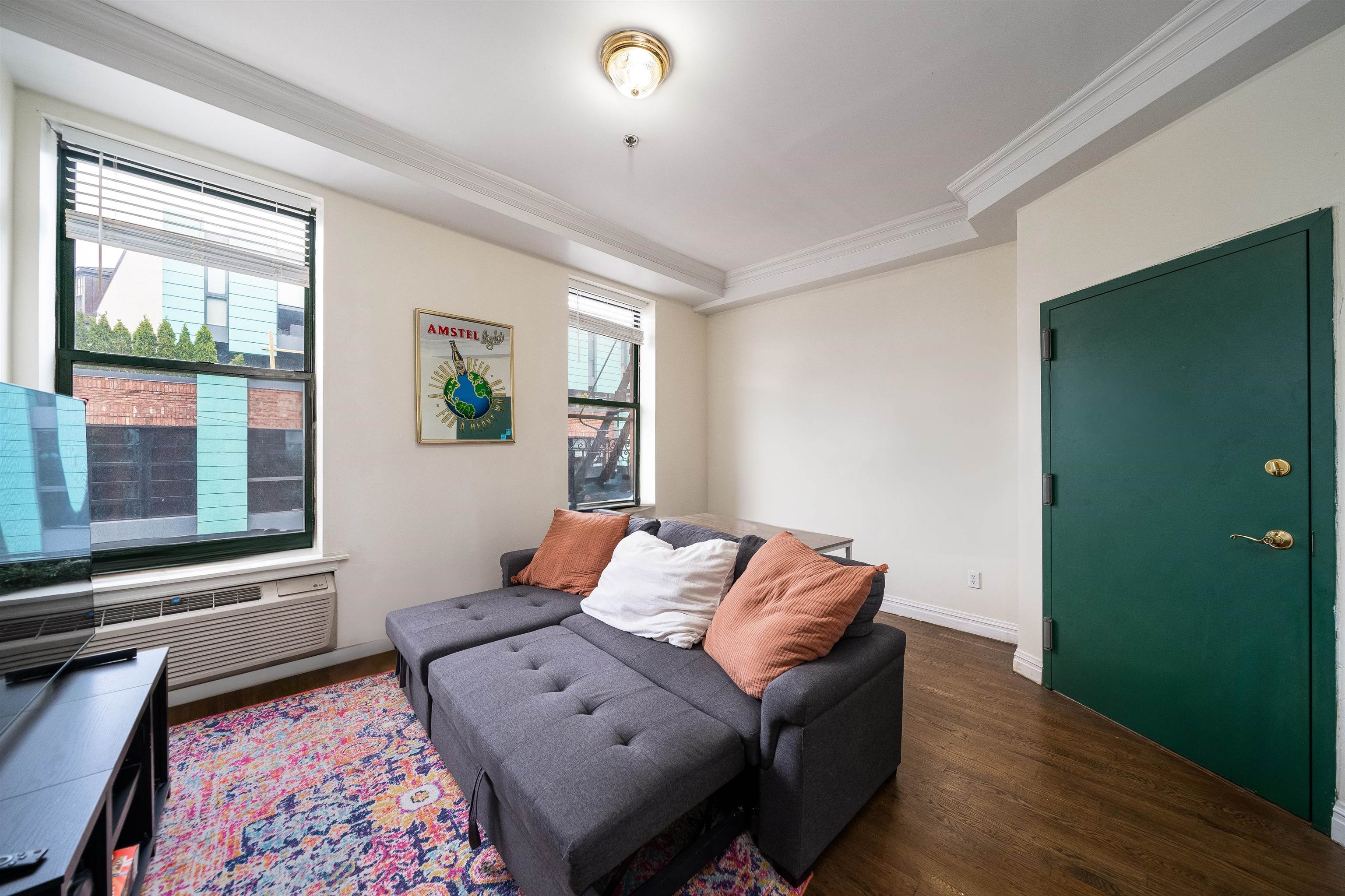 461 4th Street, Unit 3W Hoboken, NJ 07030 - Photo 3 of 12 a living room with furniture and window