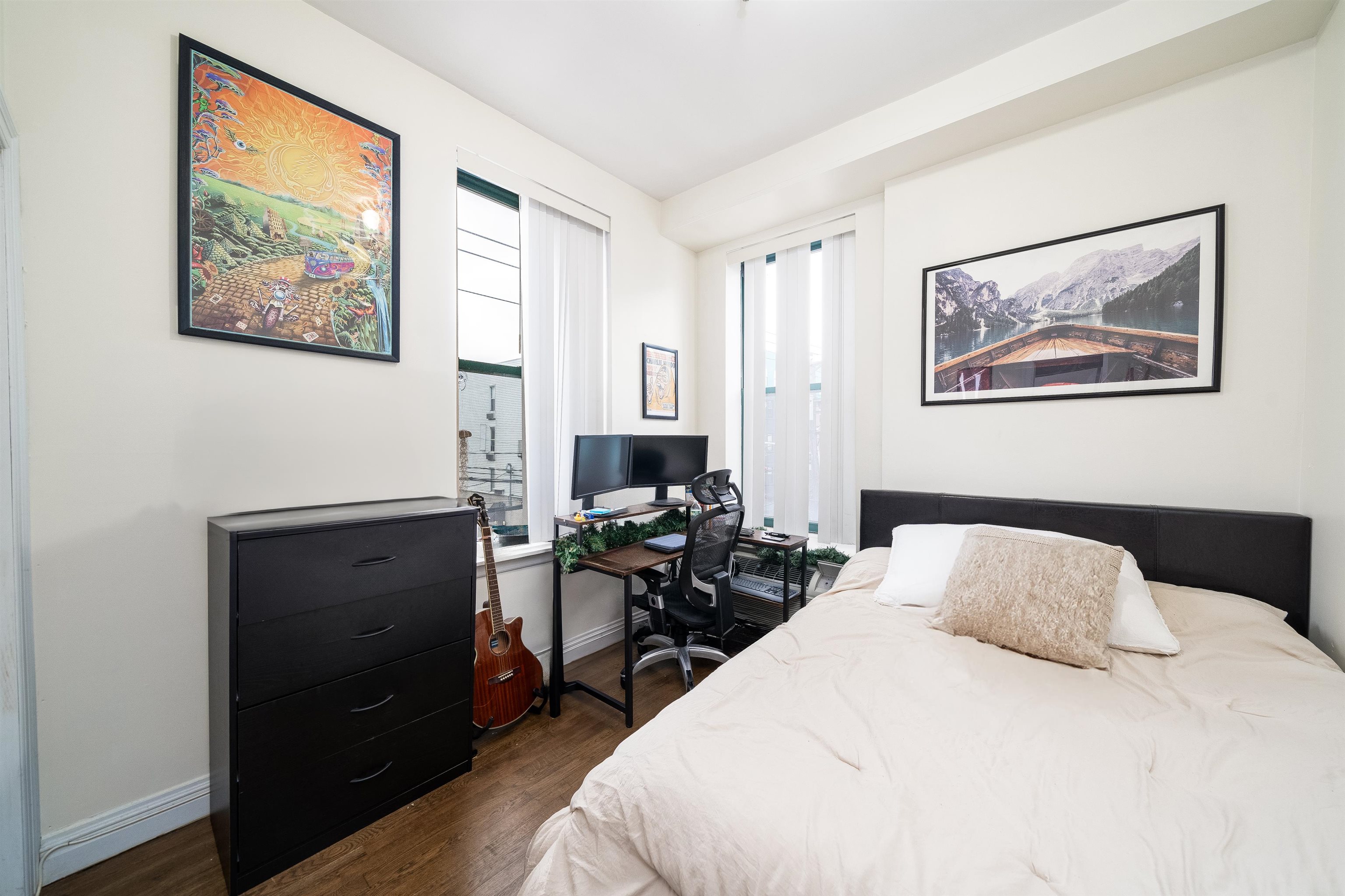 461 4th Street, Unit 3W Hoboken, NJ 07030 - Photo 8 of 12 a bedroom with a bed and wooden floor