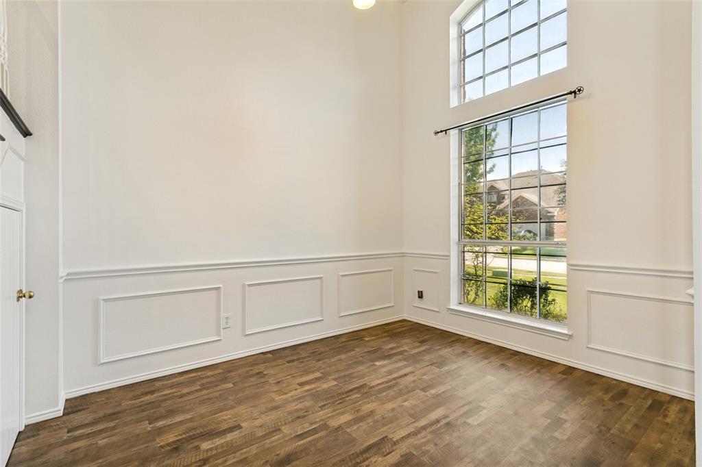 4107 Waverly Road Corinth, TX 76208 - Photo 6 of 30 This flexible space features high ceilings, lots of natural light, chair railing, picture frame molding, fresh neutral paint, and upgraded LVP flooring.