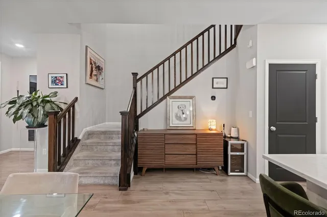a view of entryway and hall with wooden floor