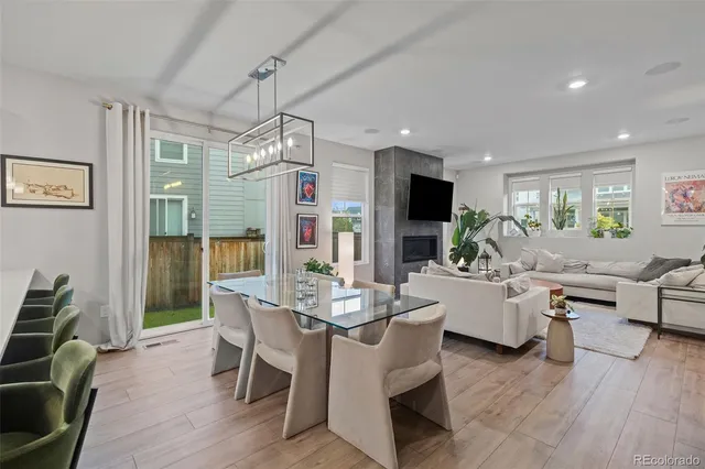 a view of a dining room with furniture window and wooden floor